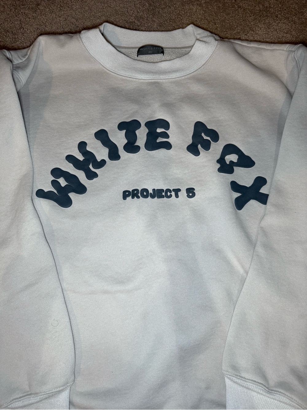 White Fox Boutique Cream Sweatshirt with Navy/Gray Graphic